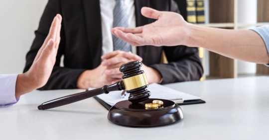 couple arguing in between an attorney