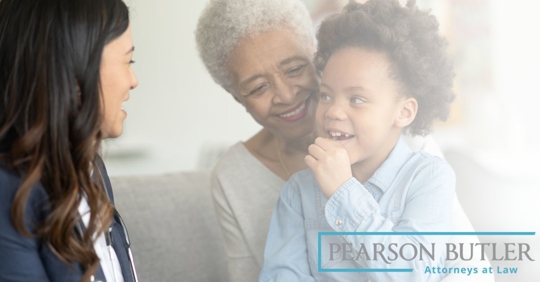 Grandmother and grandchild speaking with attorney