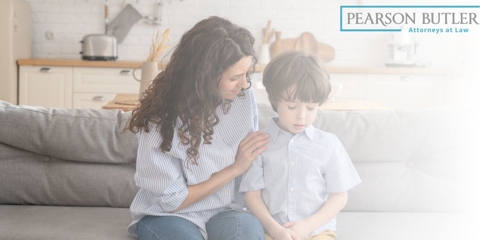 woman consoling sad child