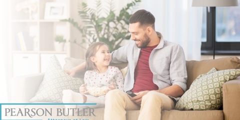father sitting down with his daughter
