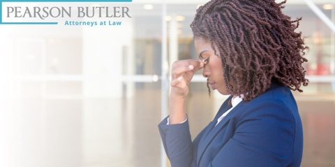 Woman holding her temple