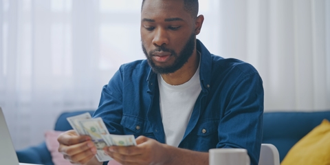 man counting money