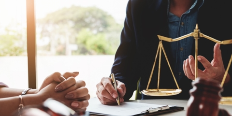 client talking with a lawyer