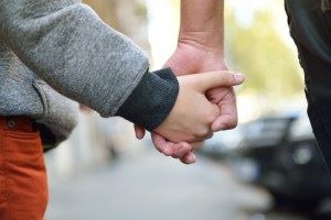 Child and Parent holding hands