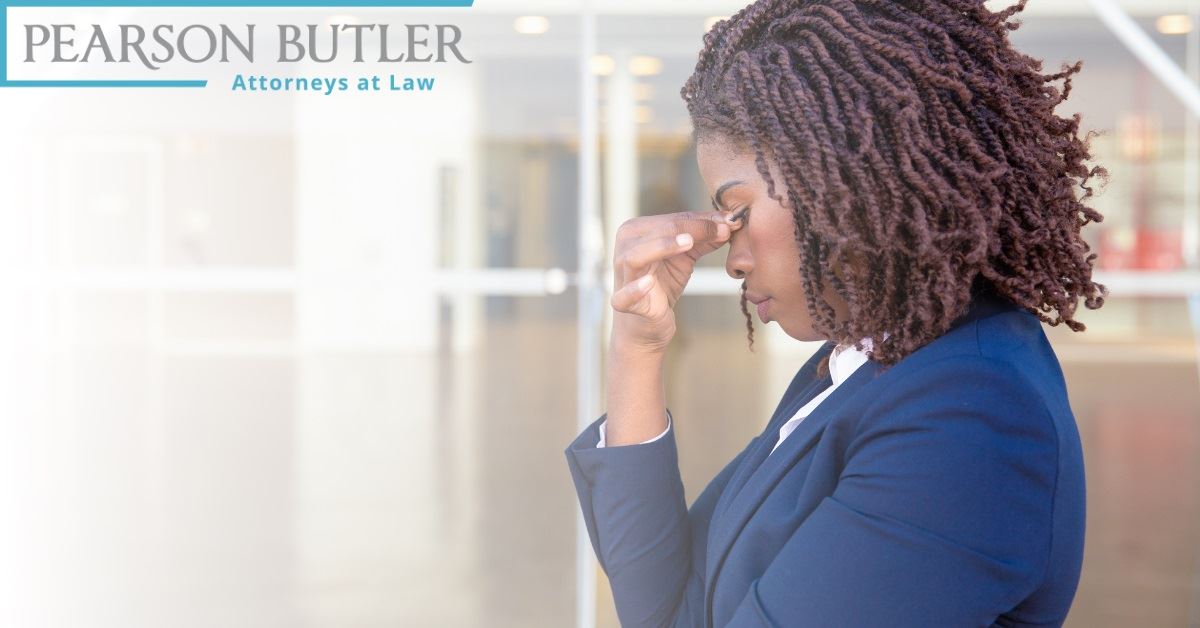 Woman holding her temple